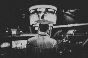 a graduate in black and white happily remembers his successful choice of sunrise aviation